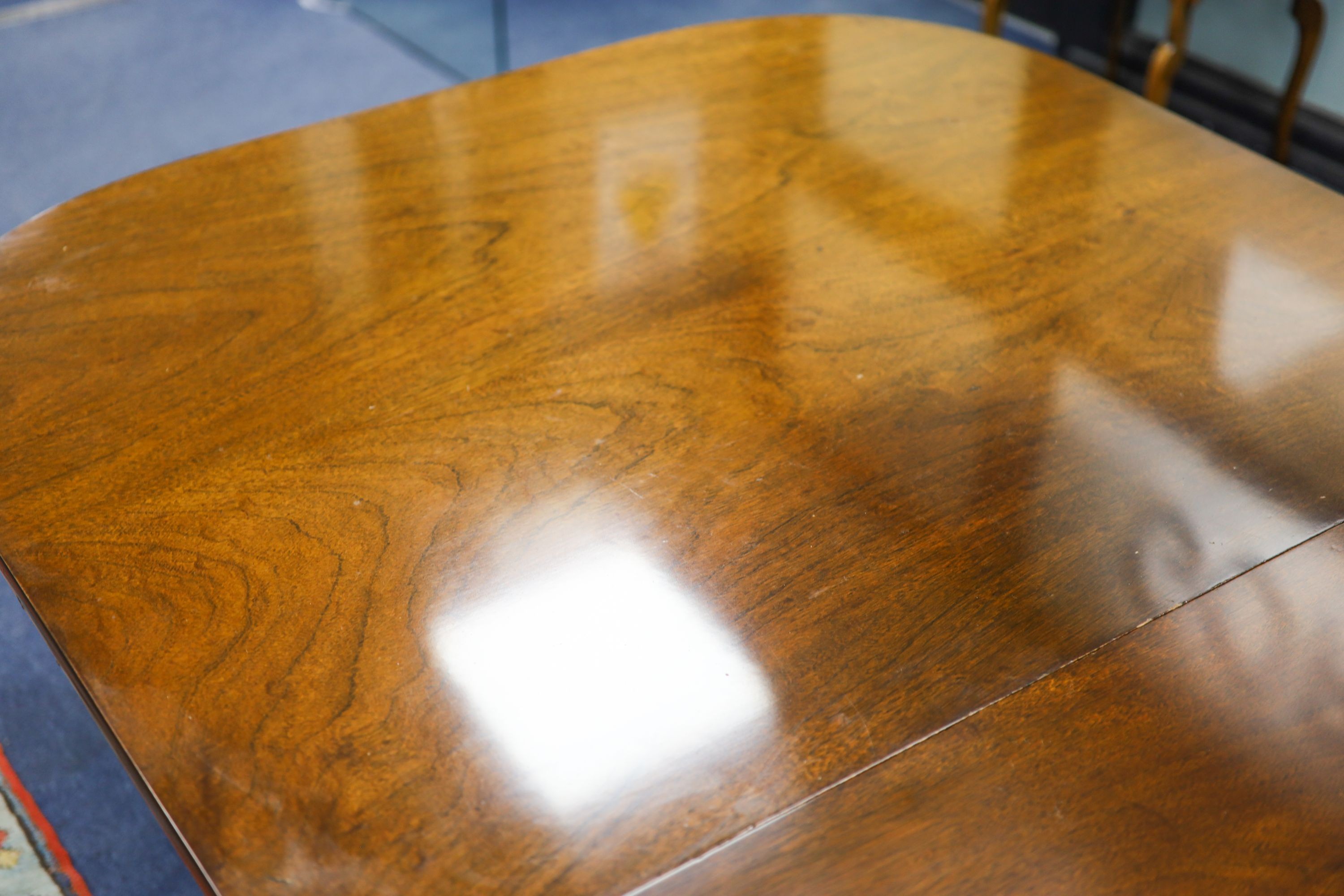 A George III style mahogany two pillar extending dining table, length 276cm extended, two spare leaves, width 114cm, height 72cm